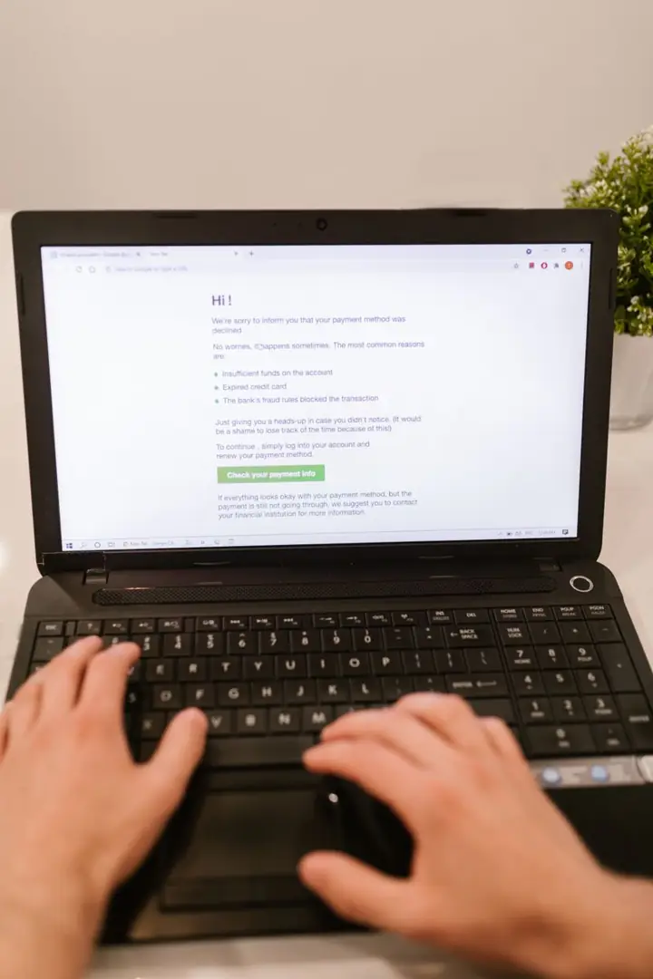 Hands on a laptop keyboard reviewing a payment screen